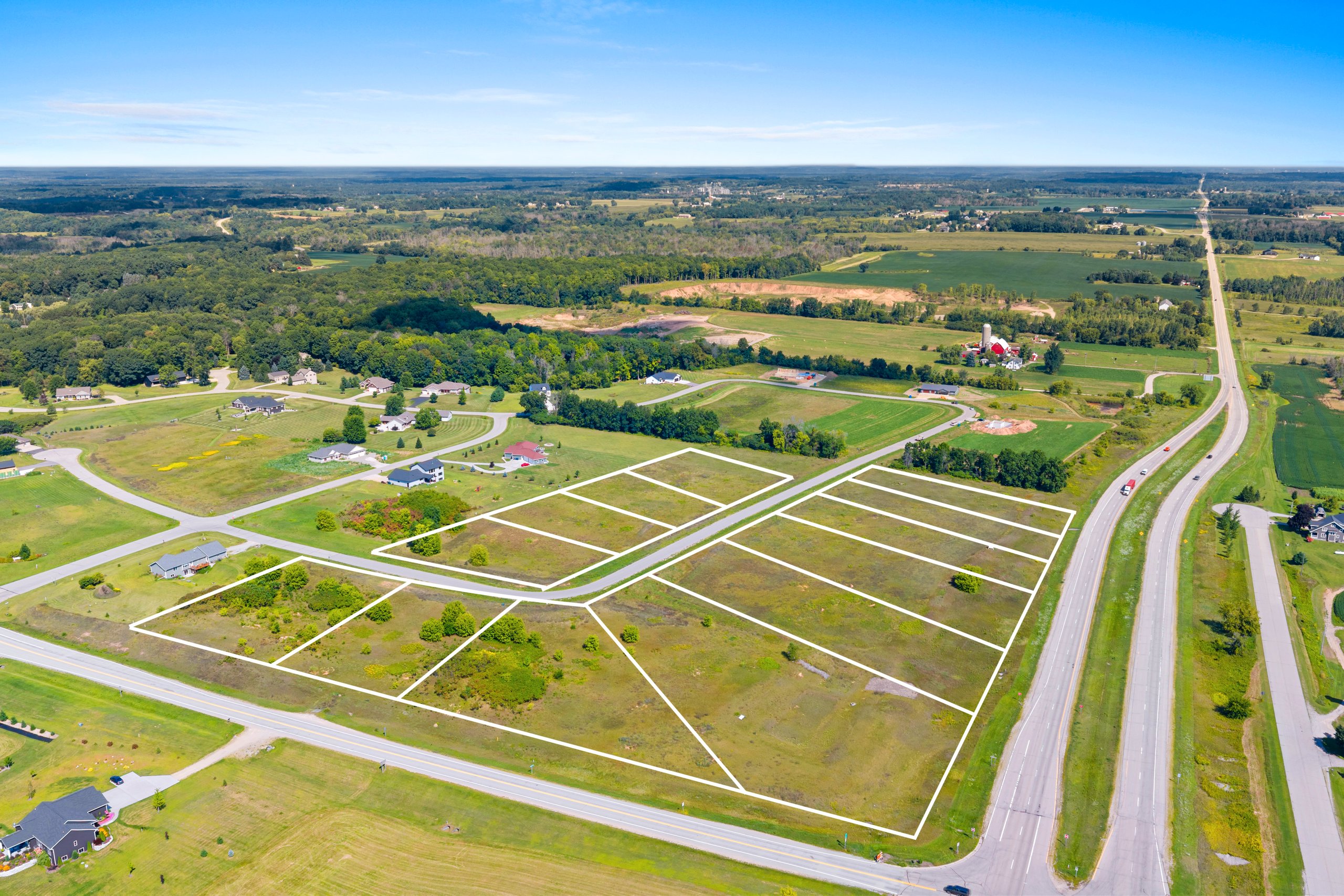 Wide subdivision overview of Woodland Hills in Caledonia