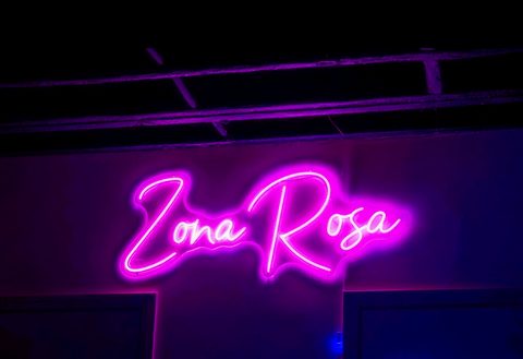 The pink 'Zona Rosa' neon script sign