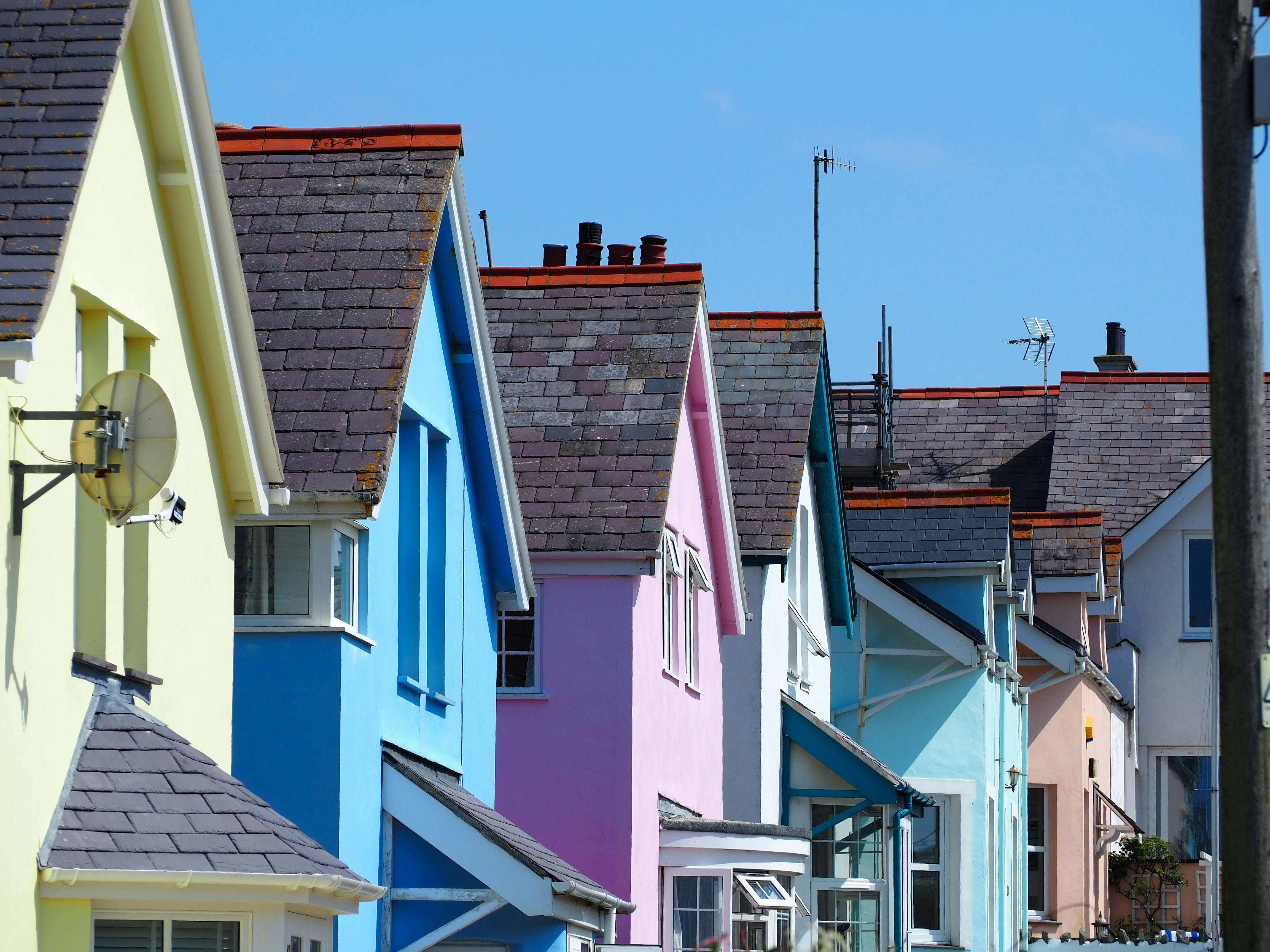 Rooftops of houses with coloured render