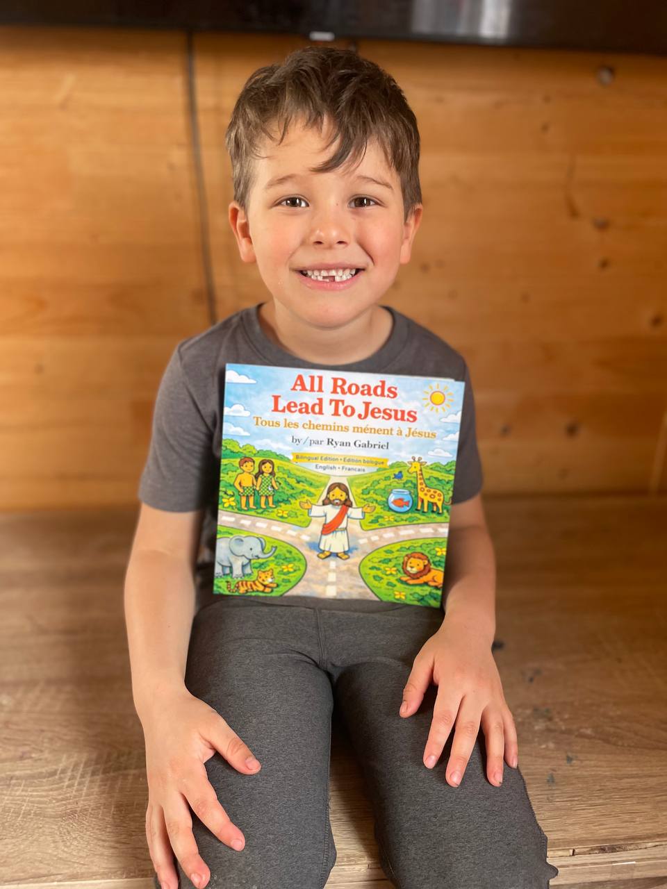 ryan gabriel sitting with his book