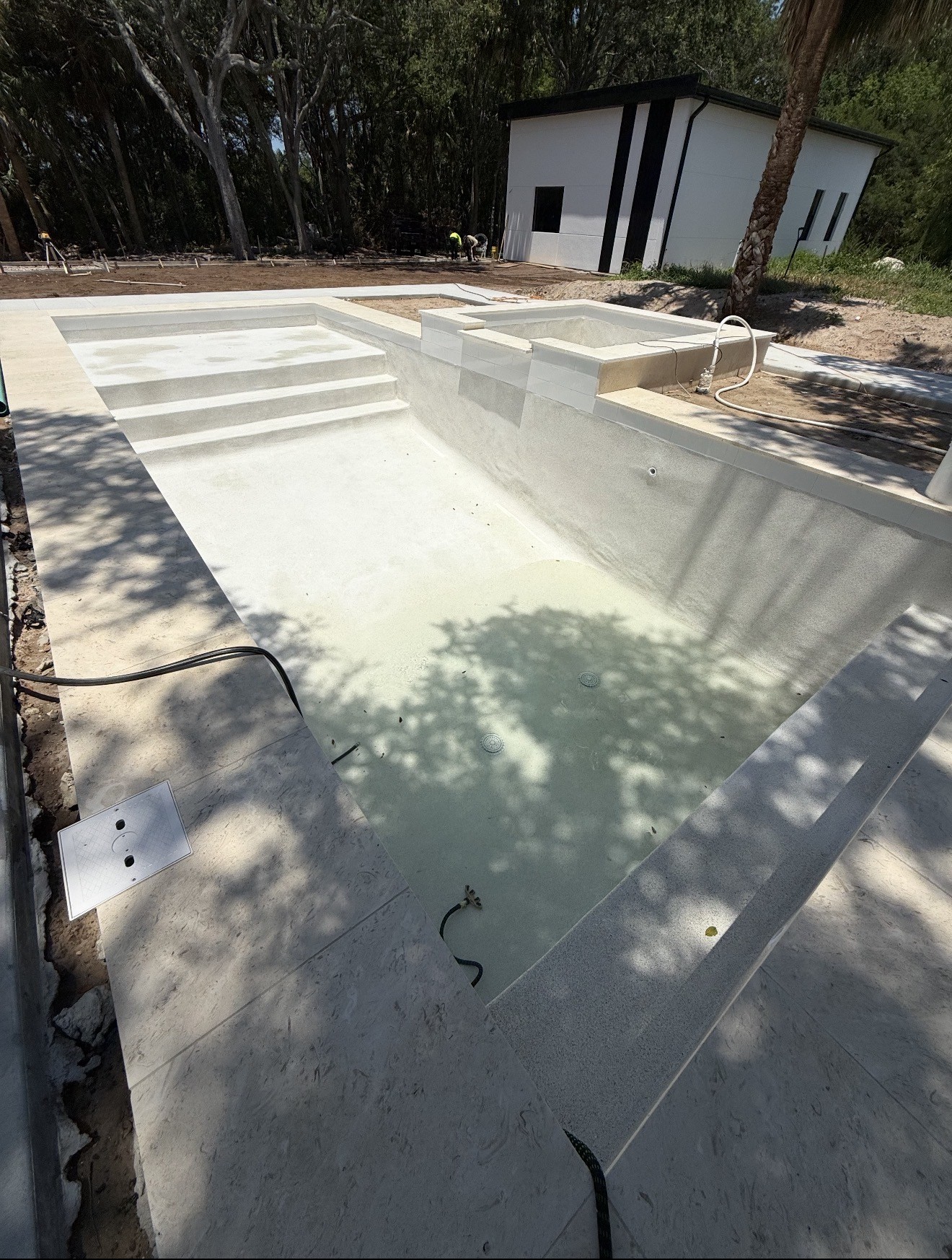Concrete swimming pool during construction before completion