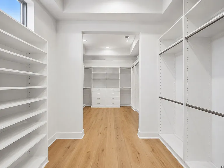 Custom walk-in closet with built-in cabinetry and organized storage