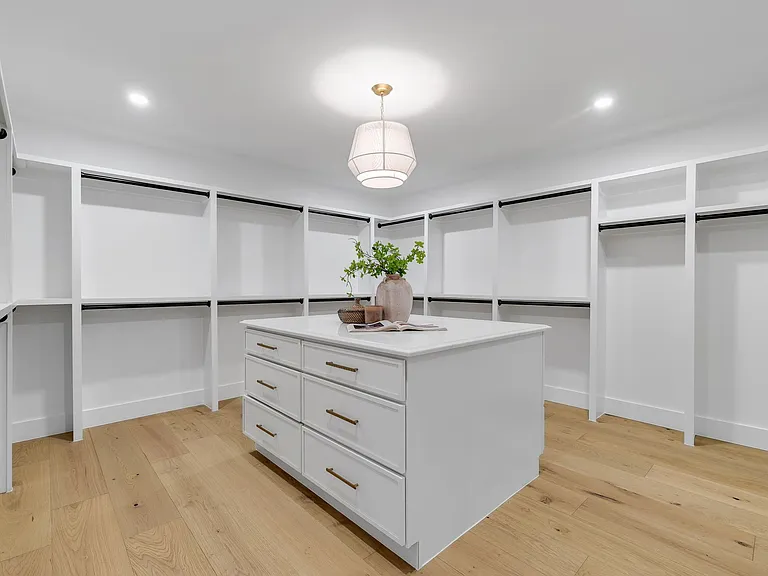 Custom closet remodeling with built-in storage and cabinetry