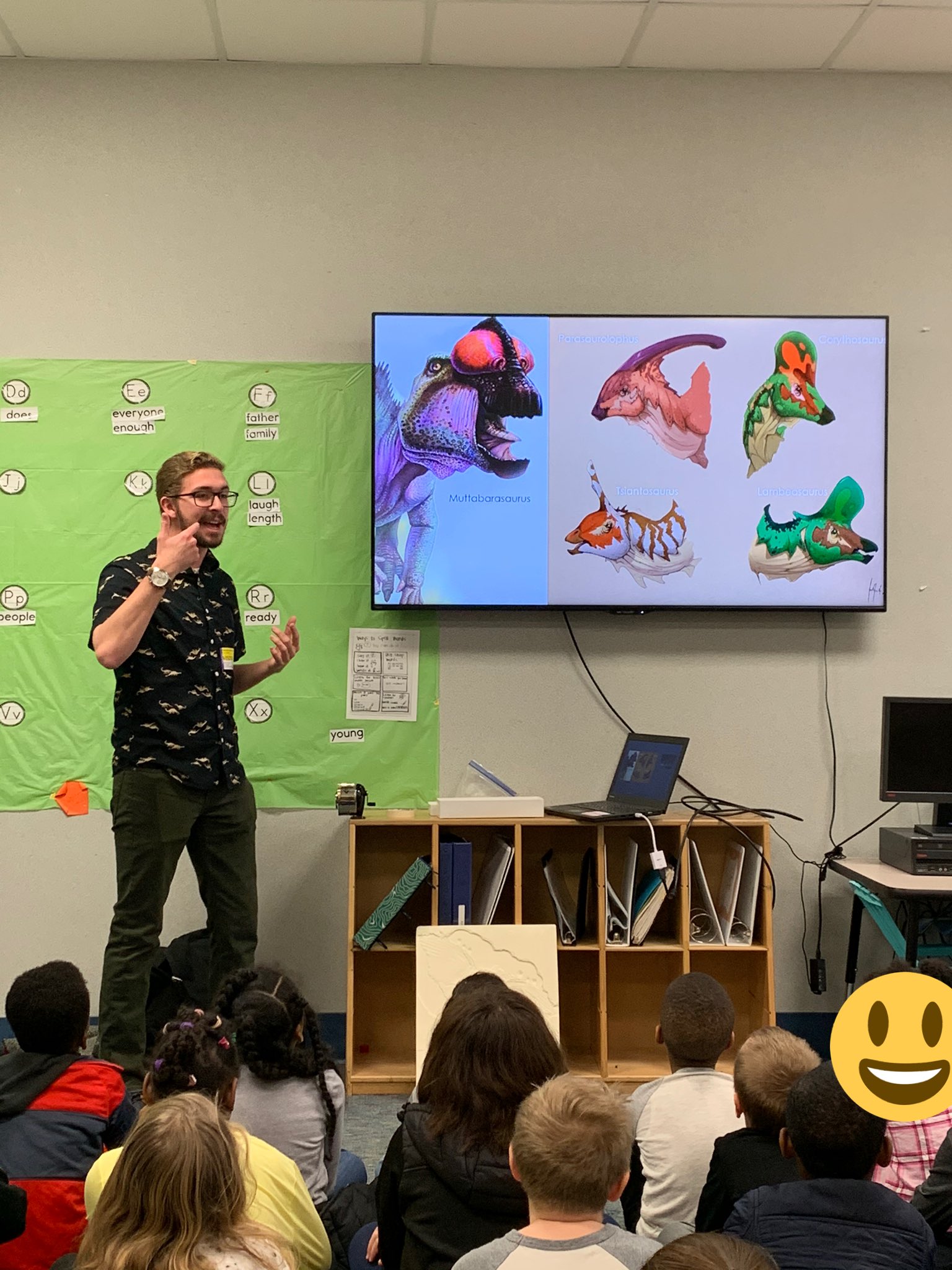 Evan Jevnikar engaging an audience with dinosaur storytelling.