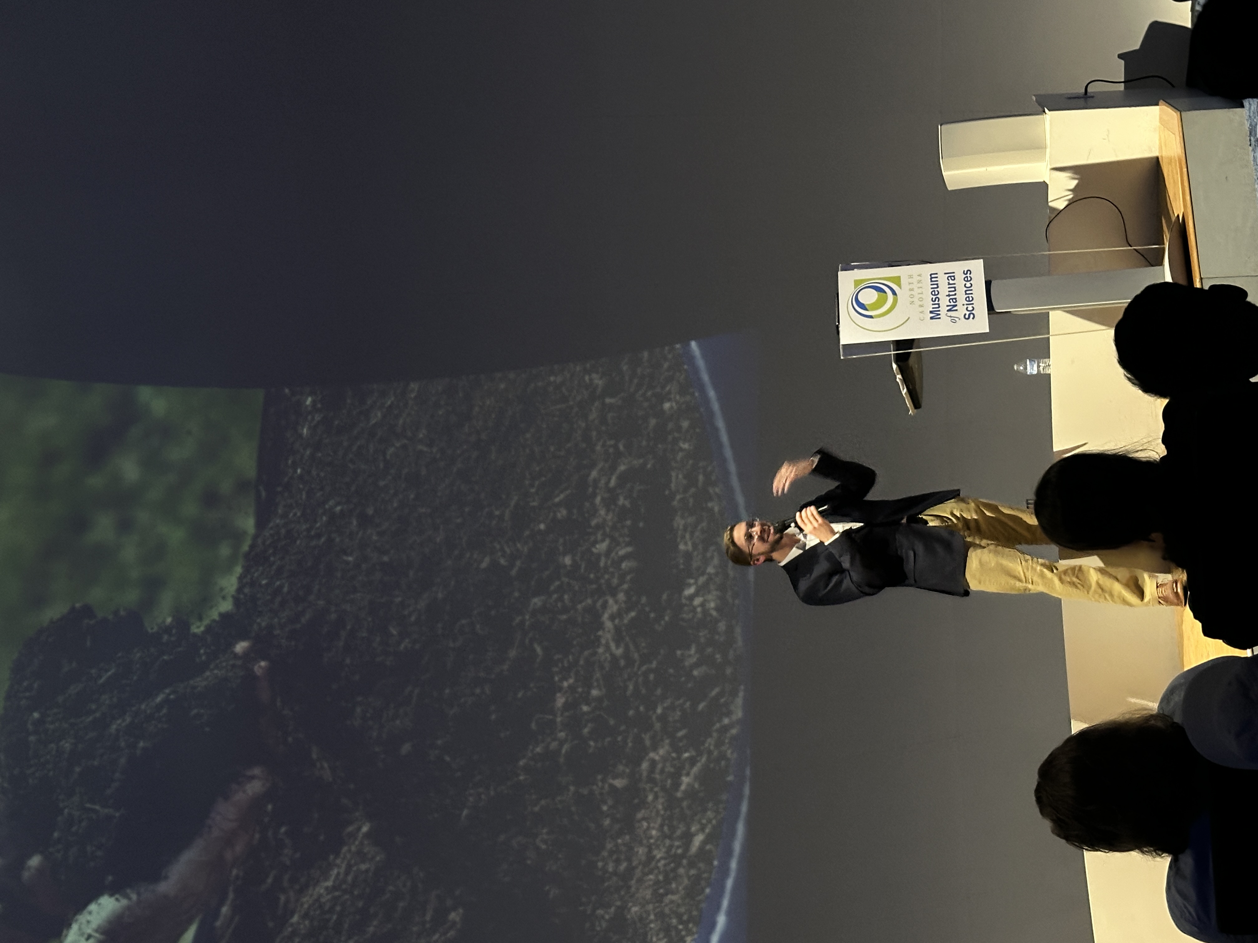 Evan Jevnikar delivering a keynote at the North Carolina Museum of Natural Sciences.