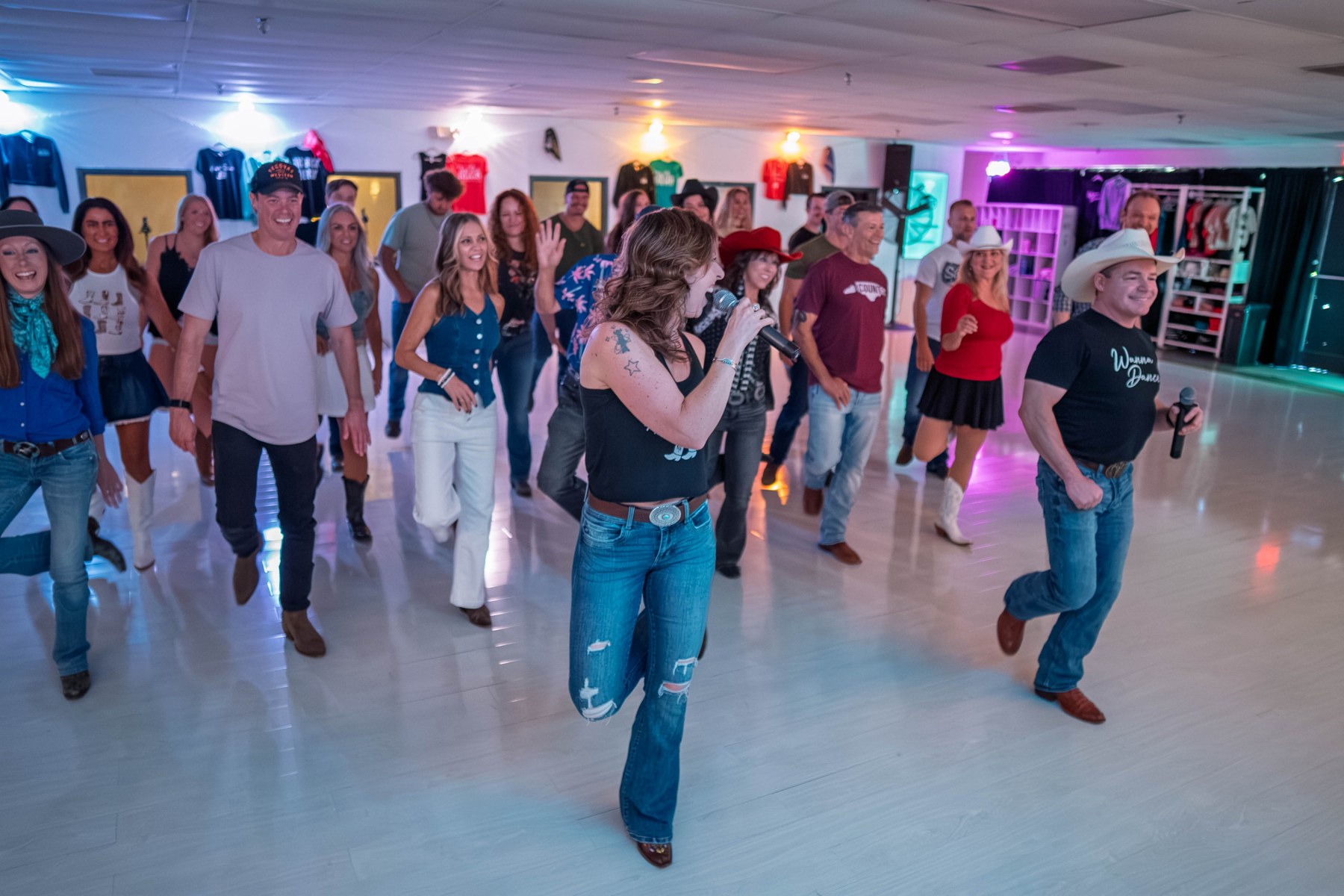 Guests learning line dances together in the studio