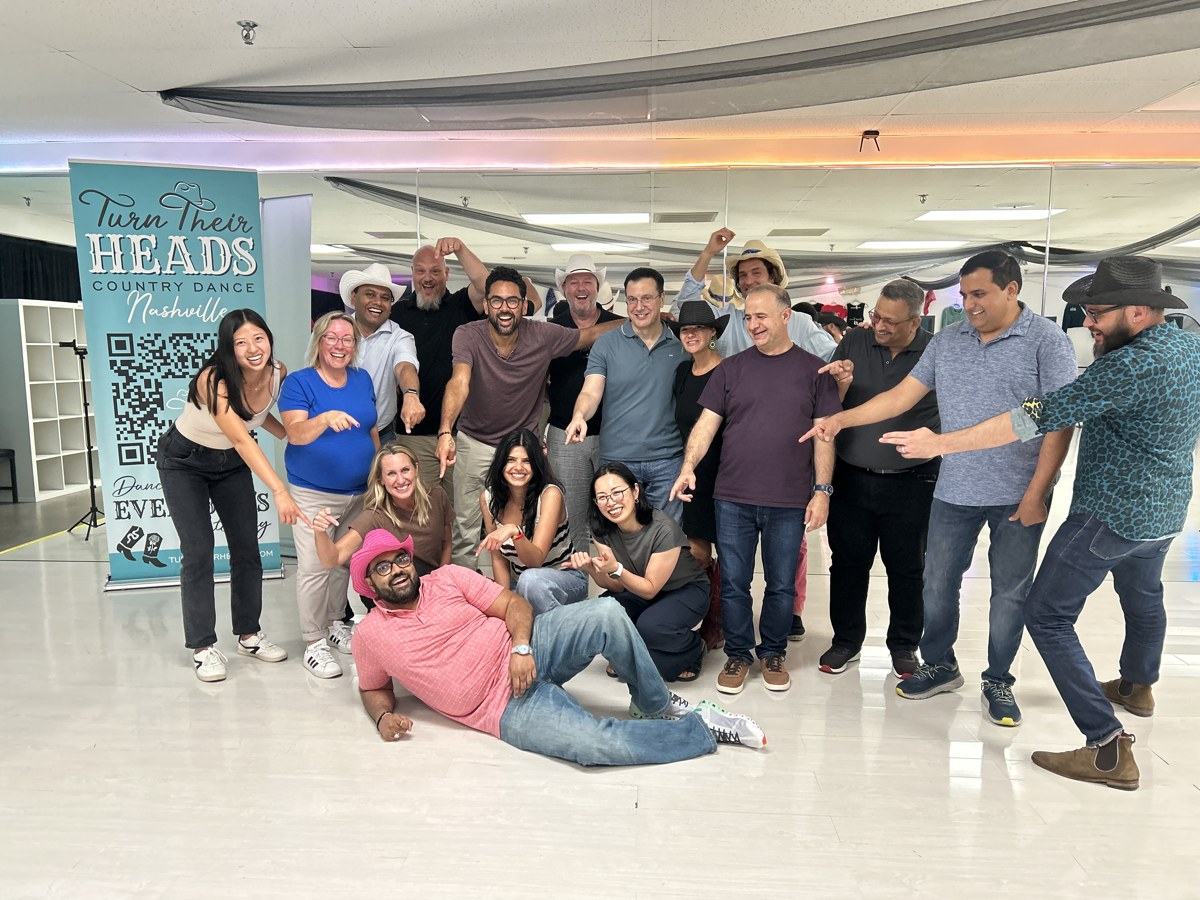 A private group celebrating together at the Turn Their Heads studio.