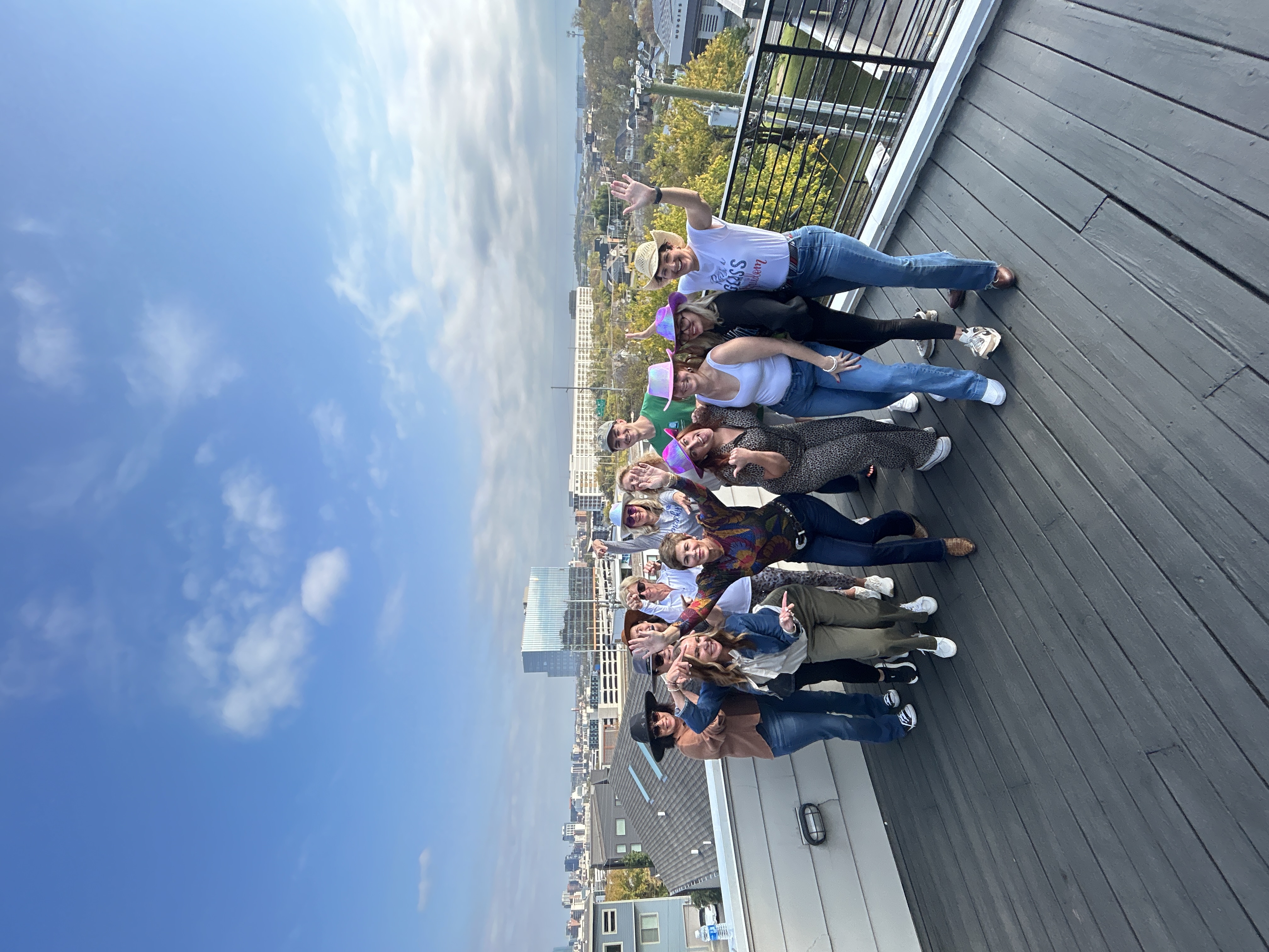 A bachelorette party celebrating together at an off-site Nashville rooftop.