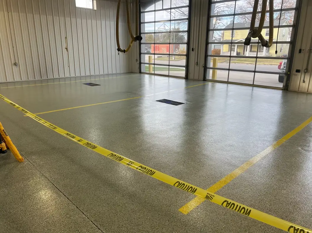 Price Concrete Coatings technician diamond grinding and prepping concrete floor in Columbia MO