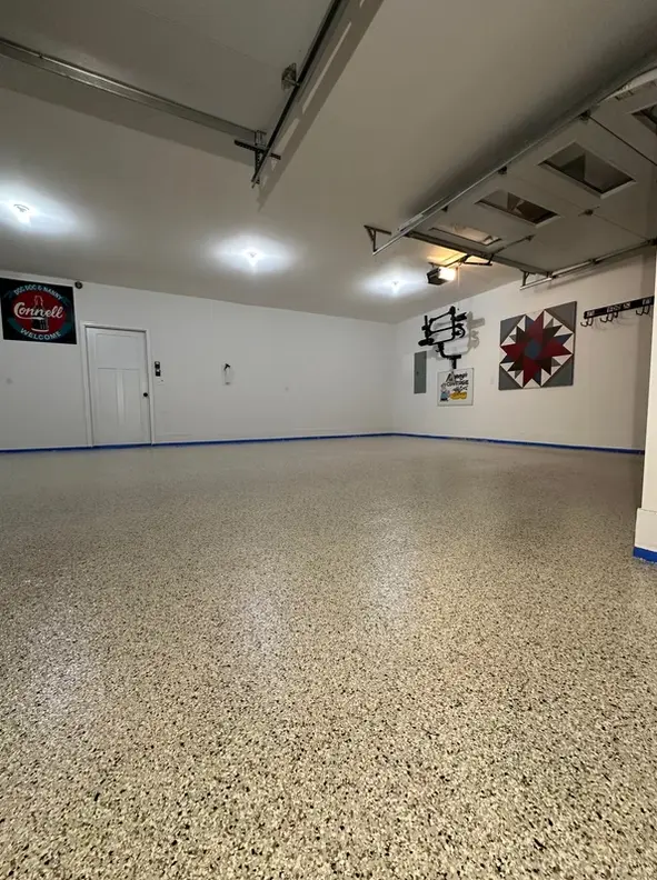 Finished high-gloss epoxy concrete floor with decorative vinyl flake coating
