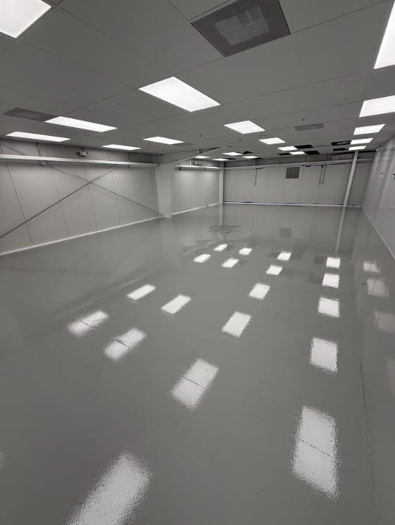 Commercial stained concrete floor in a retail space with rich color