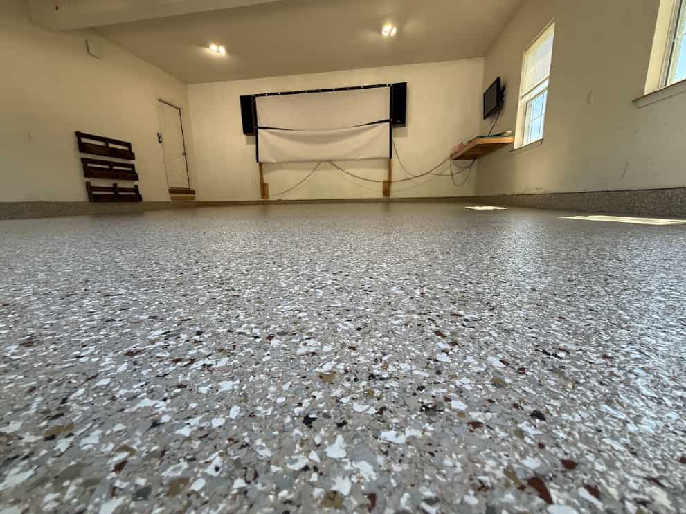 Flake floor installation mid-broadcast showing even flake coverage