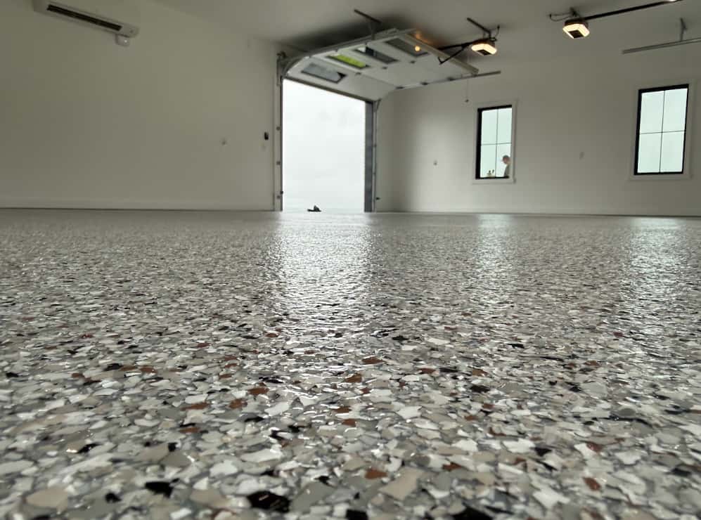 Easy-clean seamless epoxy floor being wiped down