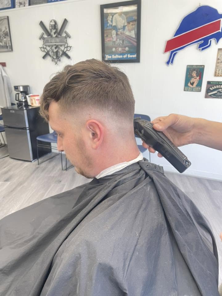 Sammi Red's Real Barbers shop interior with chairs and mirrors in Kenmore