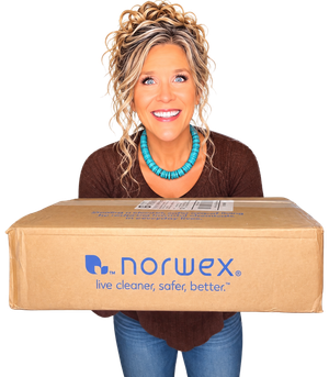 Detox Girl holding a Norwex box