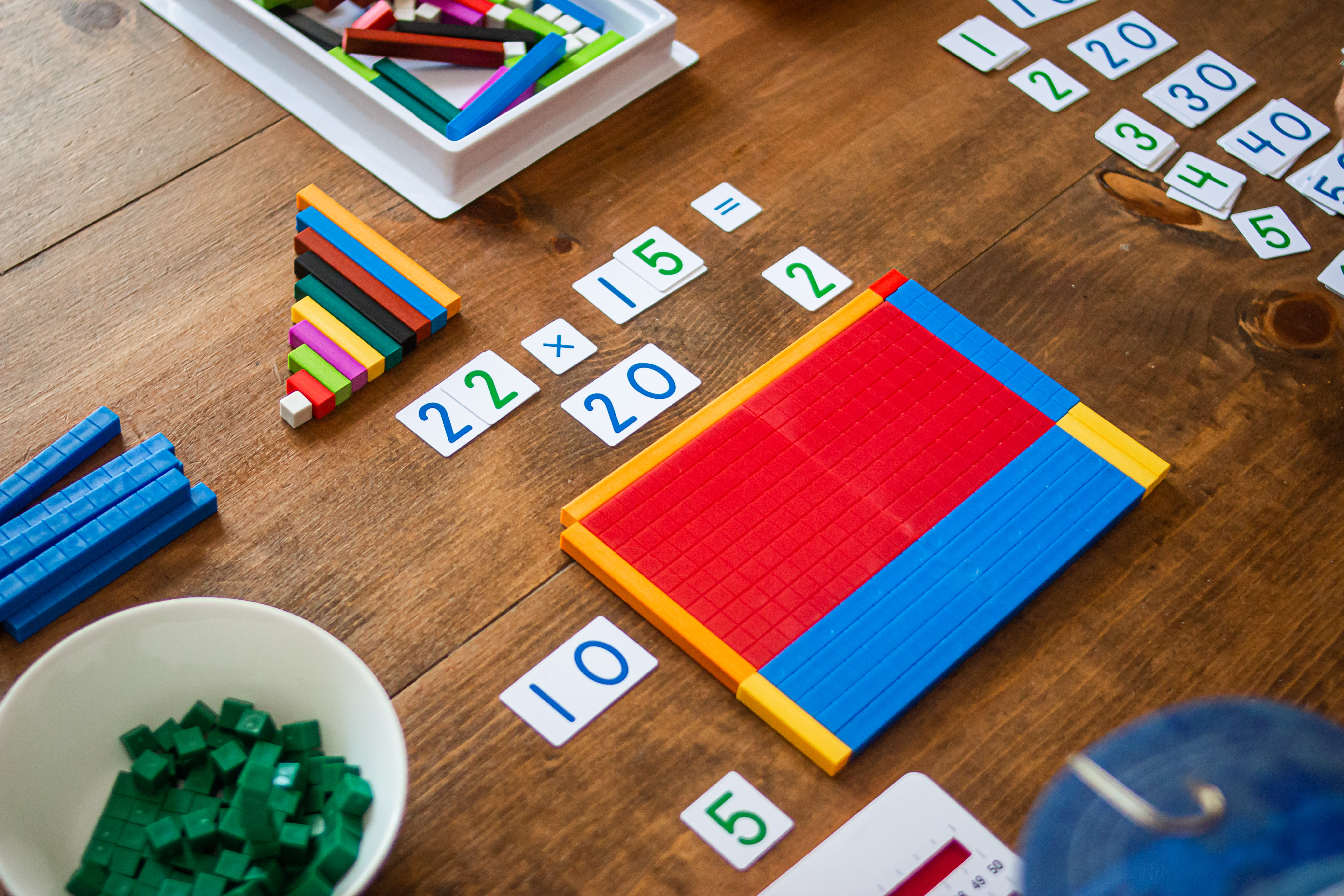 Base ten blocks and cuisenaire rods showing multiplication.