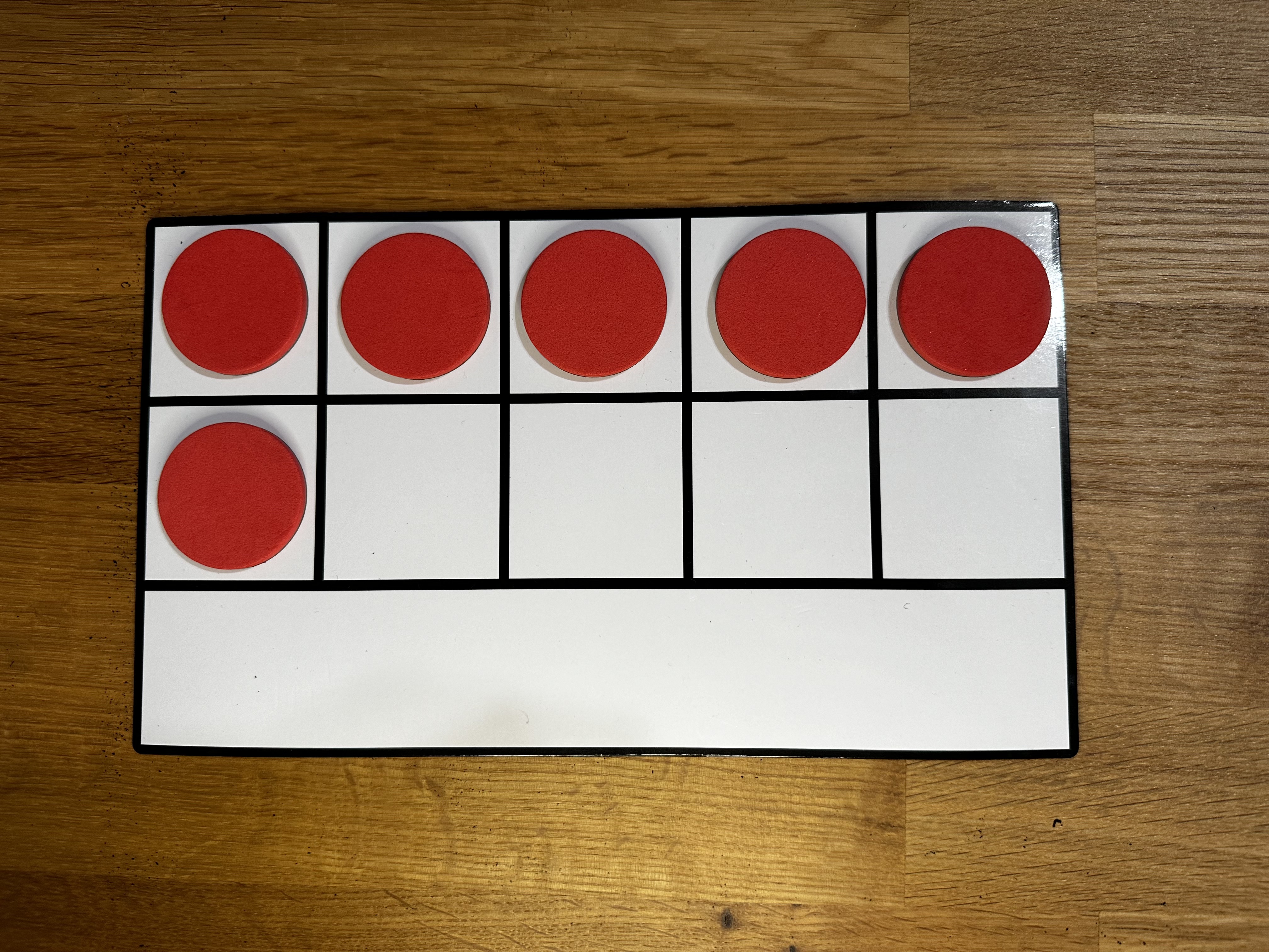 Ten frame with 6 red dots representing a visual of the quantity six. Ten frame with 6 red dots representing a visual of the quantity six.