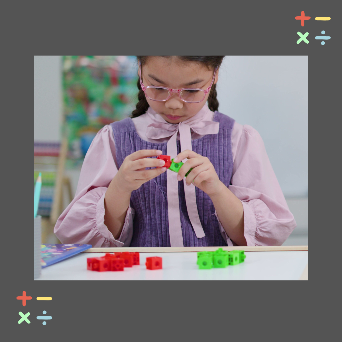 Young girl with glasses working independently with colorful linking cube manipulatives at a classroom desk illustrating hands on math tools that support students with dyscalculia