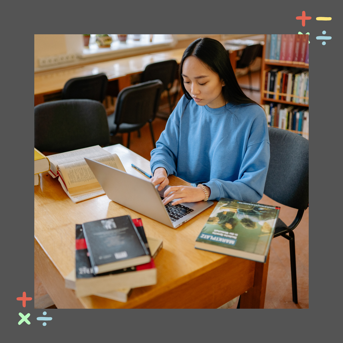 College student studying at a library desk with a laptop and open books illustrating how students with dyscalculia can use campus resources to succeed in college College student studying at a library desk with a laptop and open books illustrating how students with dyscalculia can use campus resources to succeed in college