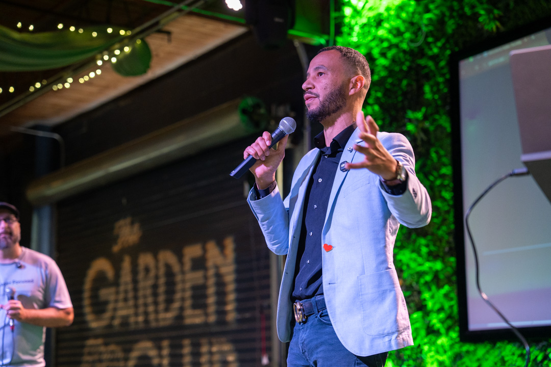 Michael James Johnson speaking on stage