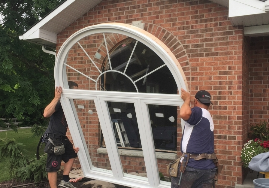 Custom arched window installation in Ottawa home by professional installers