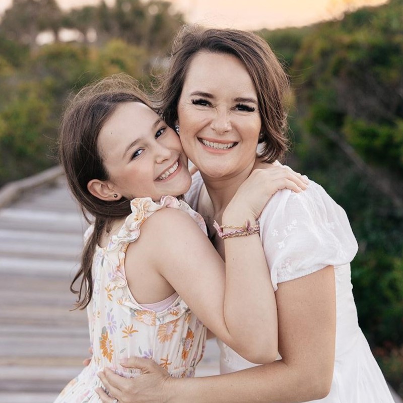 Andrea and Sami hugging on a outdoor background.