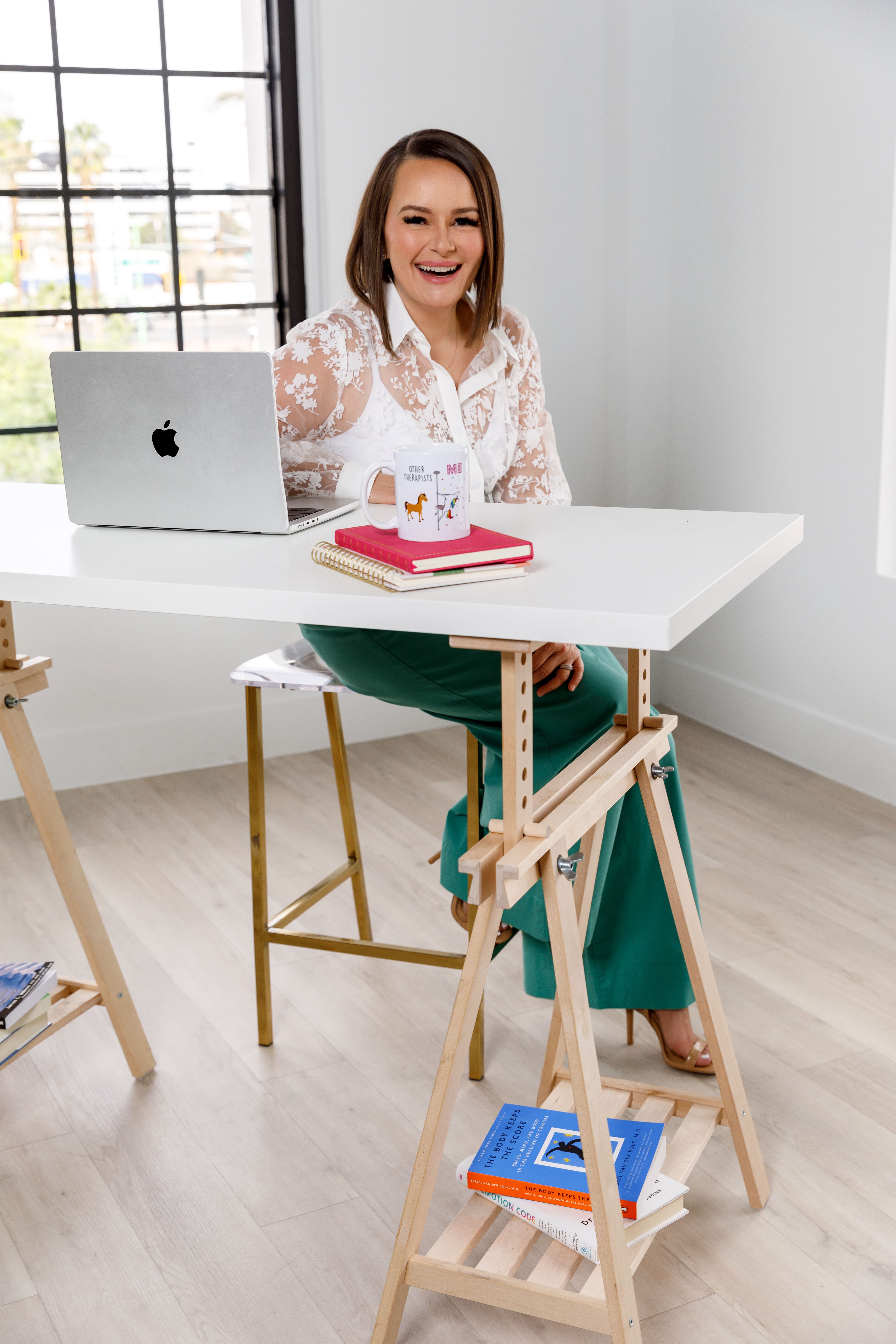 Andrea at her desk