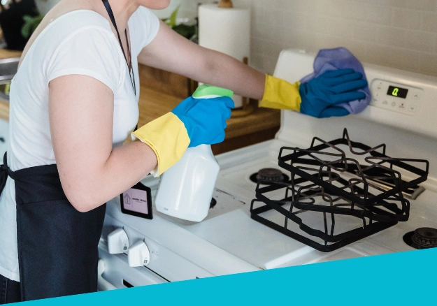 Viv’s Way Cleaning Service wiping down kitchen benches during a residential clean