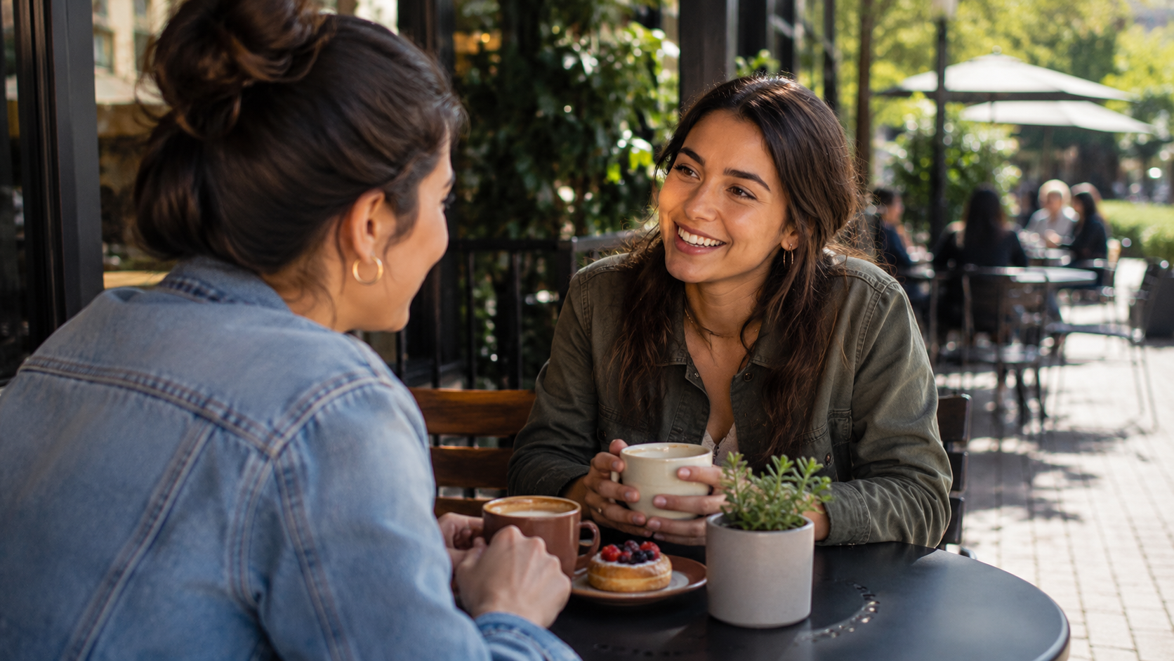 Two women talking about their travel savings plan Two women talking about their travel savings plan