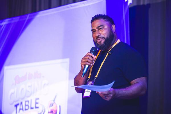 Henry speaking at the Closing Table event