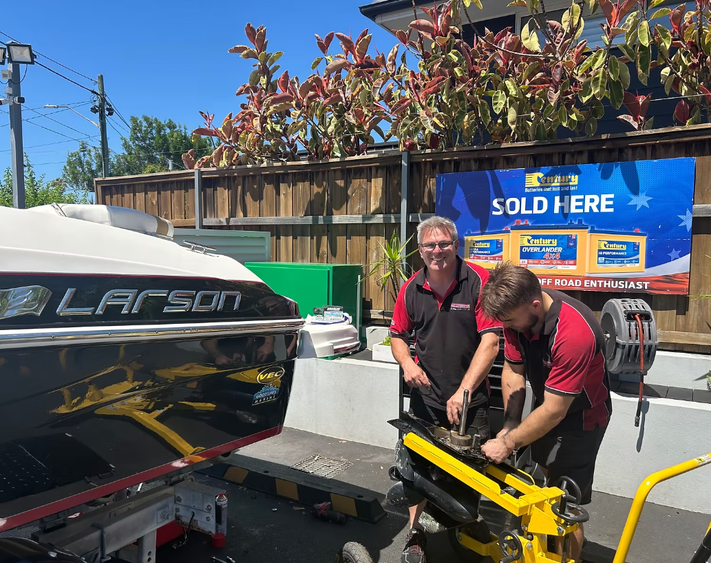 313 Automotive technicians servicing a boat trailer and marine equipment at the workshop, supporting 313 Marine services
