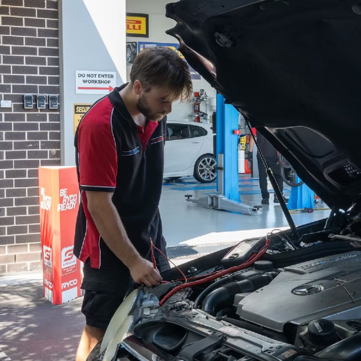 Auto electrician diagnosing vehicle electrical system at 313 Automotive Russell Lea