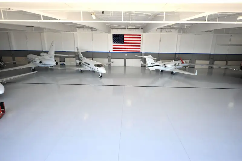 Airplanes in their epoxy coated hangar