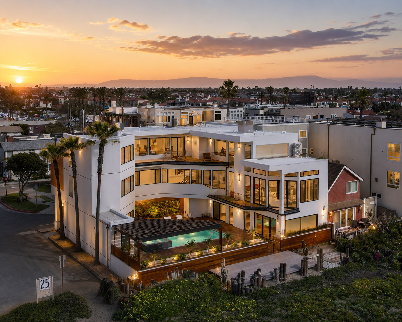 Luxury coastal home with rooftop greenery at sunset, Orange County
