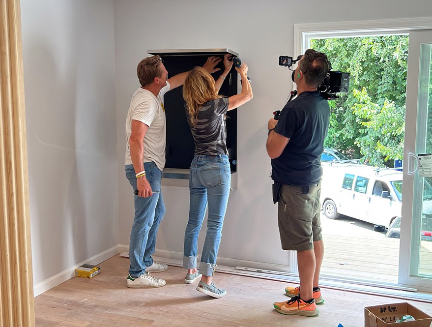 Behind-the-scenes television production during installation of a residential living wall