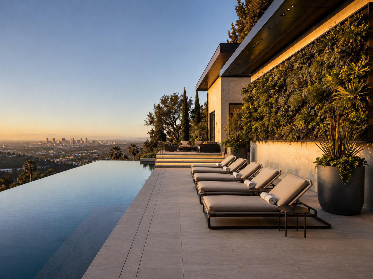 Hillside residential living wall beside an infinity pool at sunset, Southern California luxury home