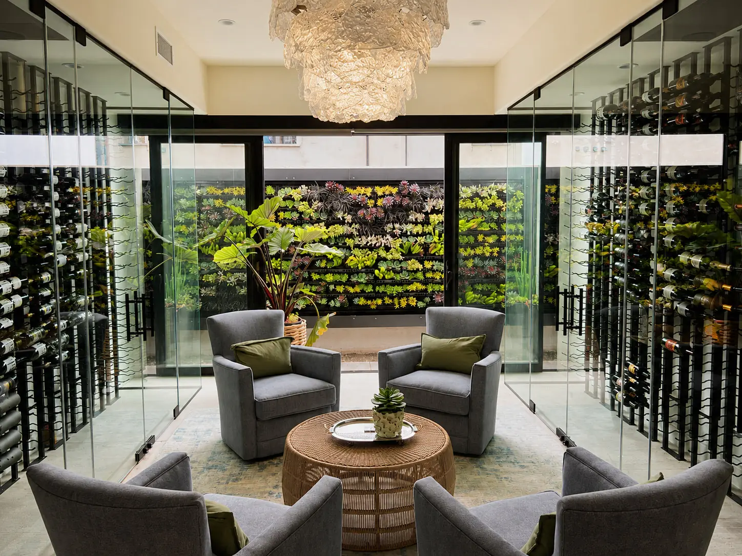 Hotel lobby living wall viewed through glass doors behind lounge seating
