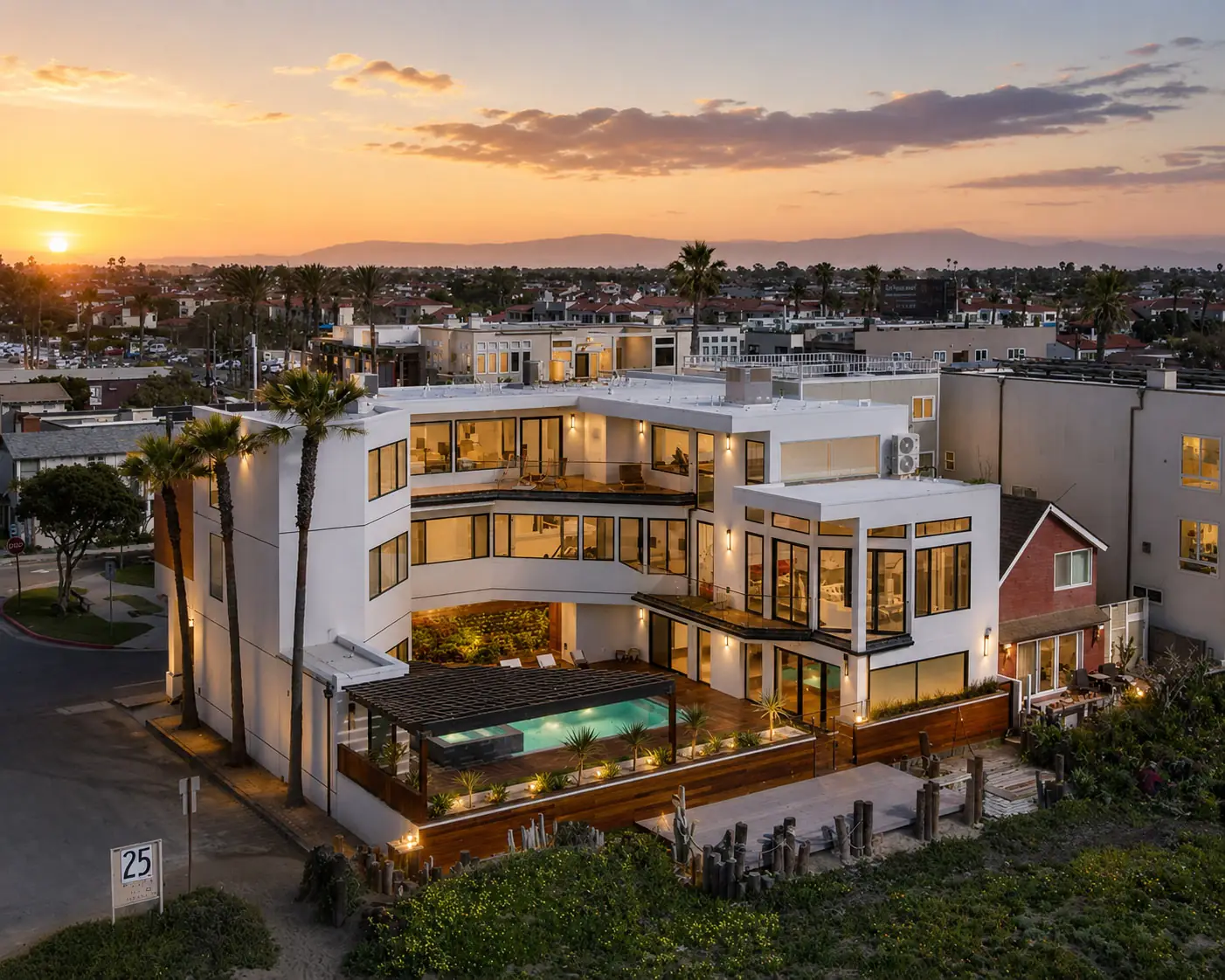 Luxury coastal home with rooftop greenery at sunset, Orange County