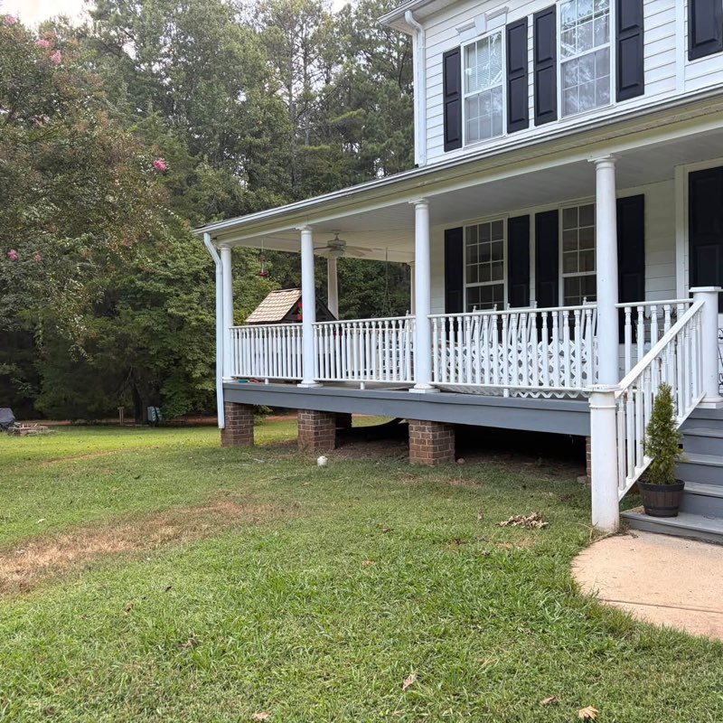 Before: plain grass right up to the porch foundation