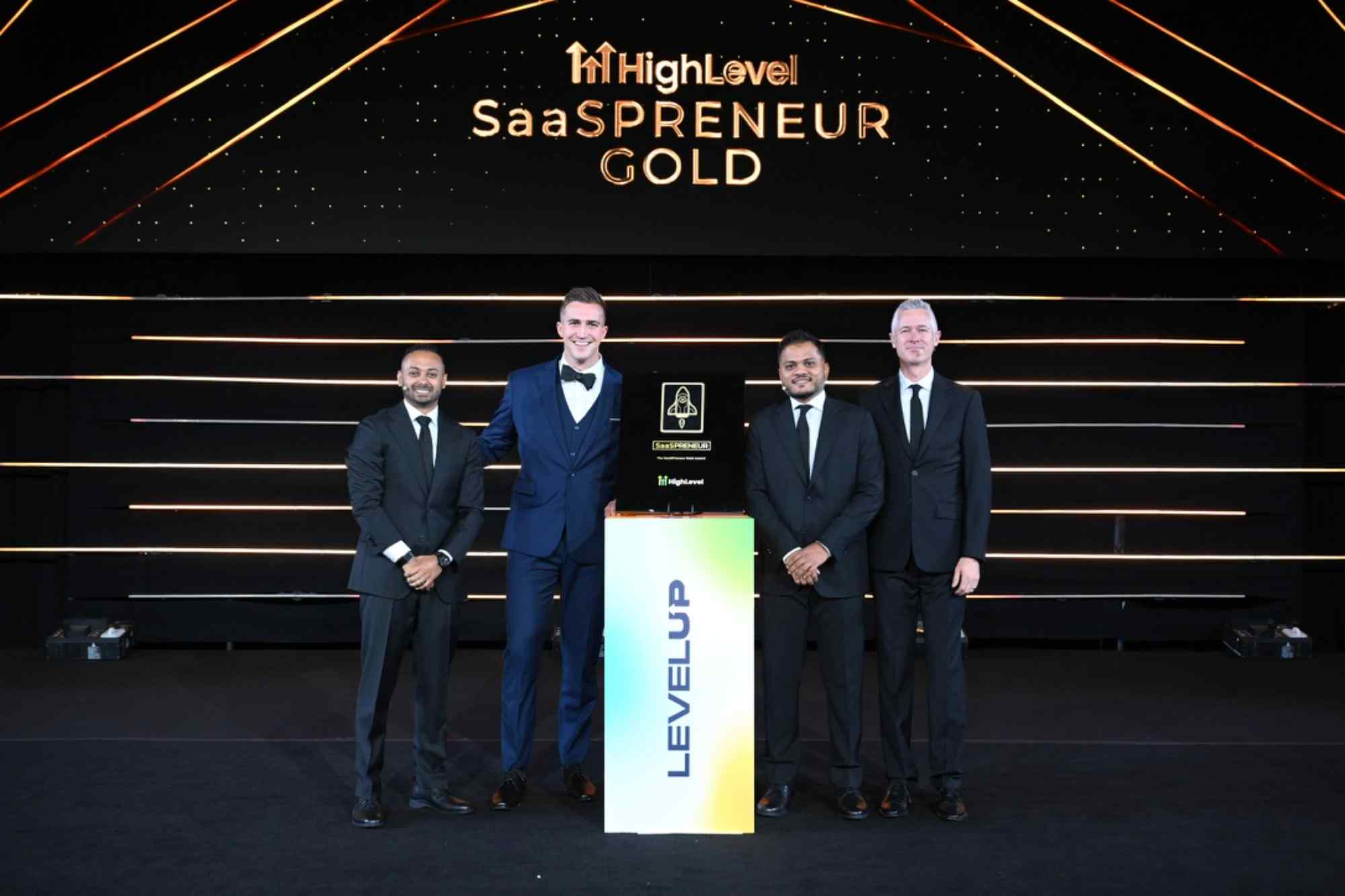 Nuon Marketing team receiving SaaSPRENEUR Gold Award from GoHighLevel