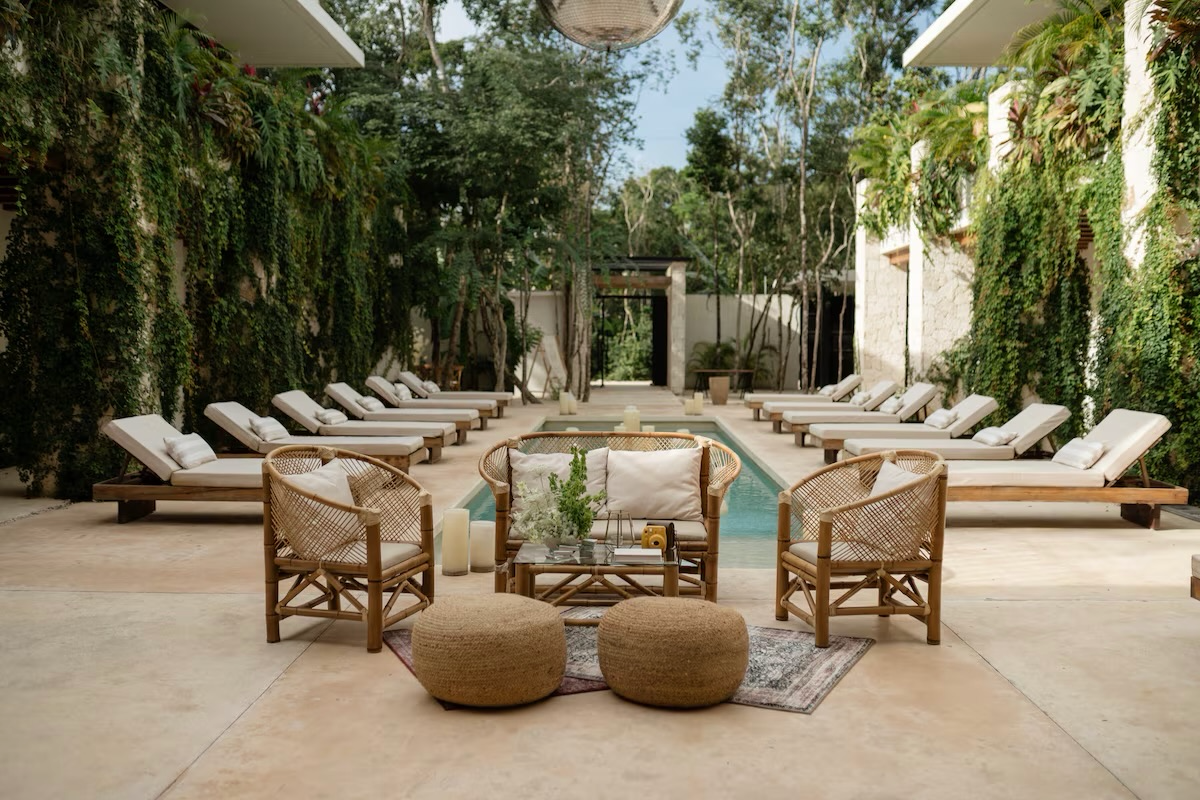 Outdoor lounge surrounded by greenery