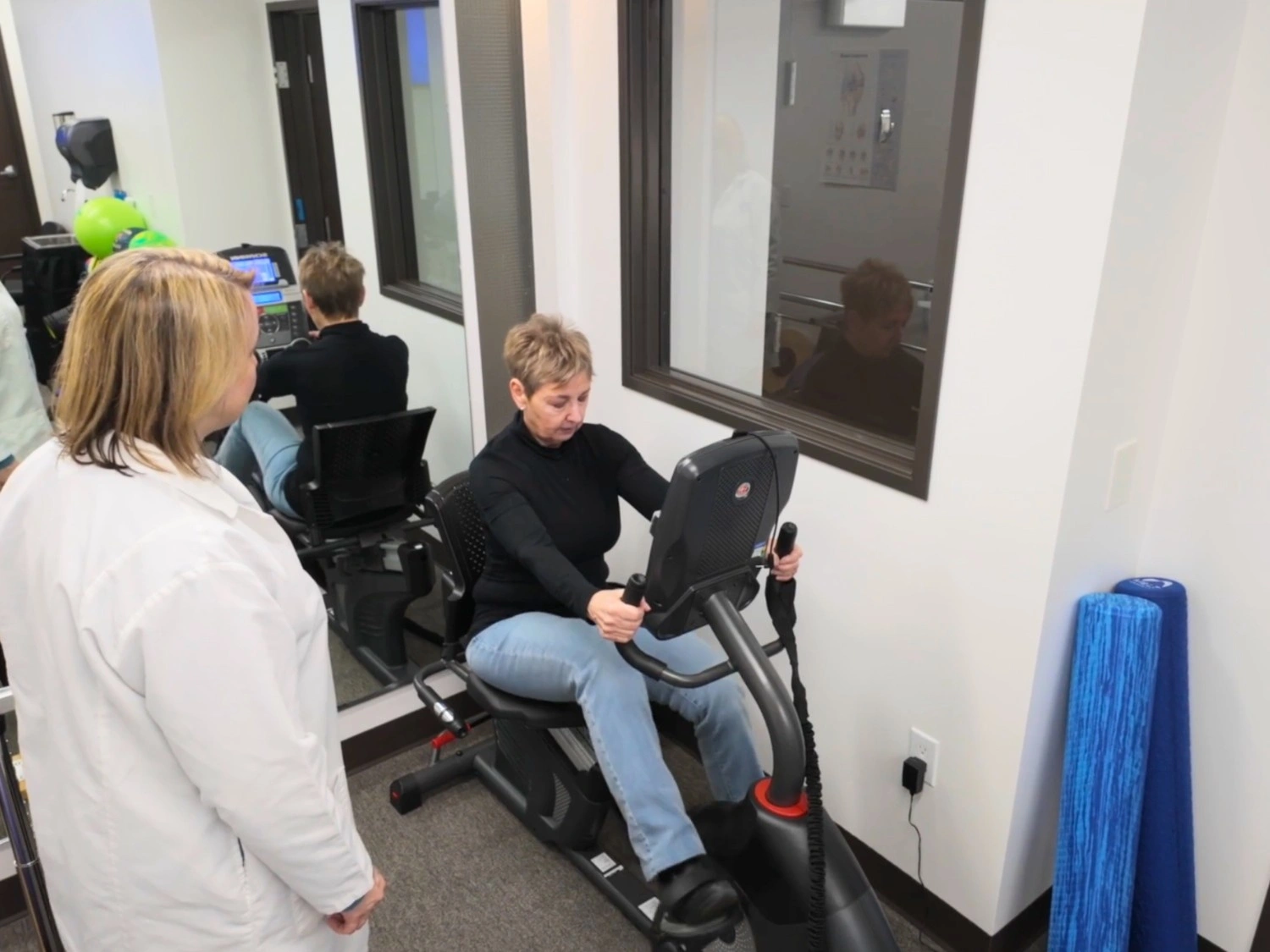 Physical therapist helping patient at Northwest Physical Therapy Care