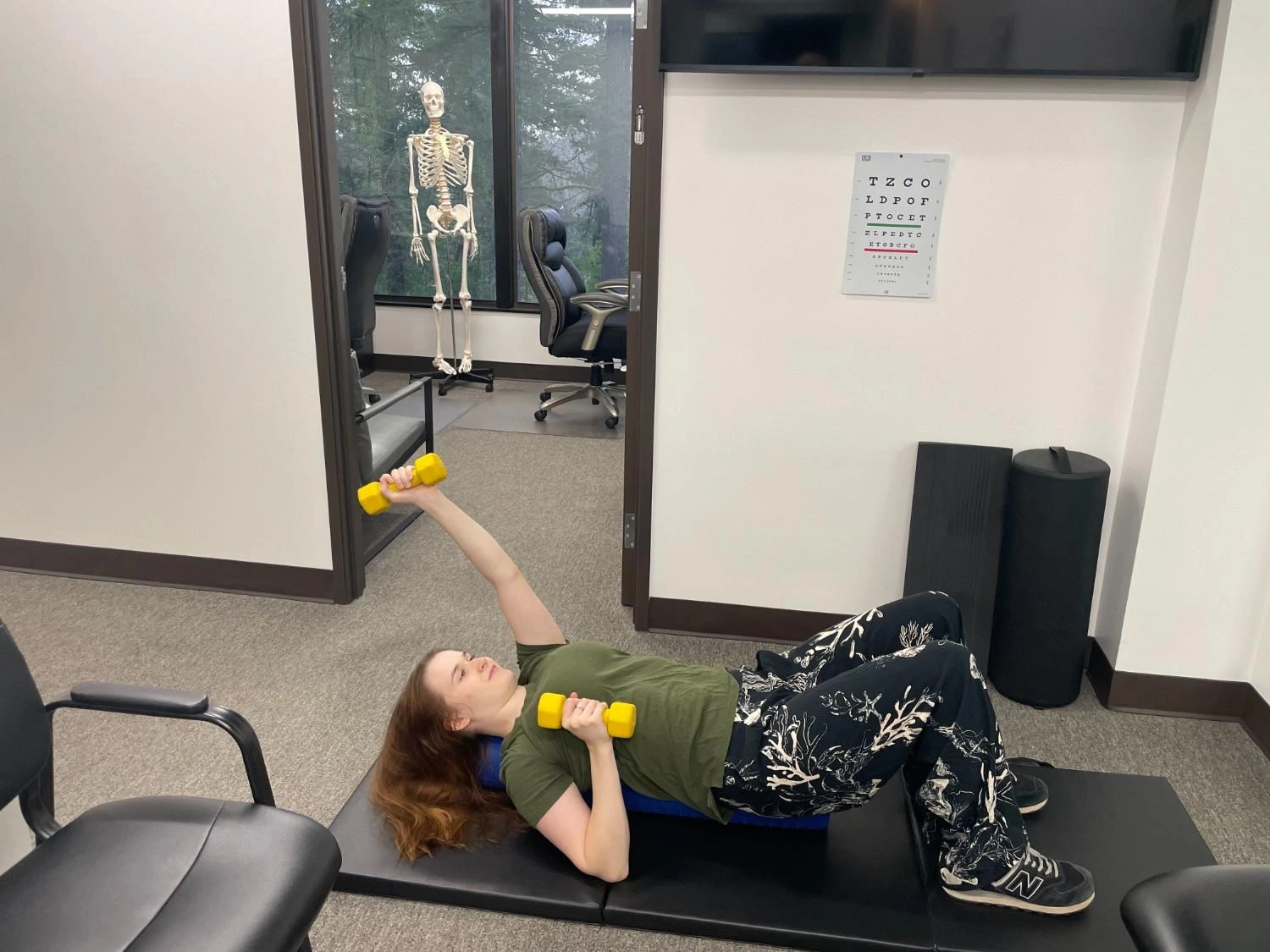 Physical therapy patient doing dumbbell exercises at Northwest PT Care