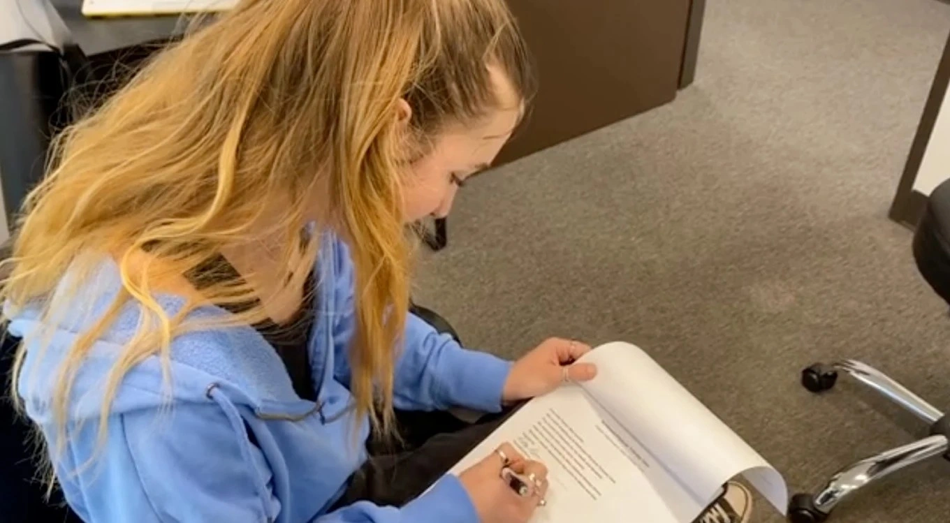 Patient reviewing paperwork at Northwest Physical Therapy Care