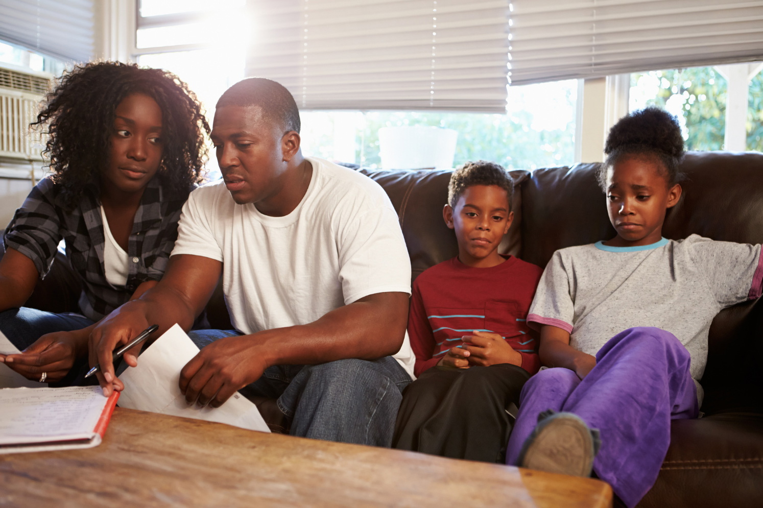 A family working through bills together at home