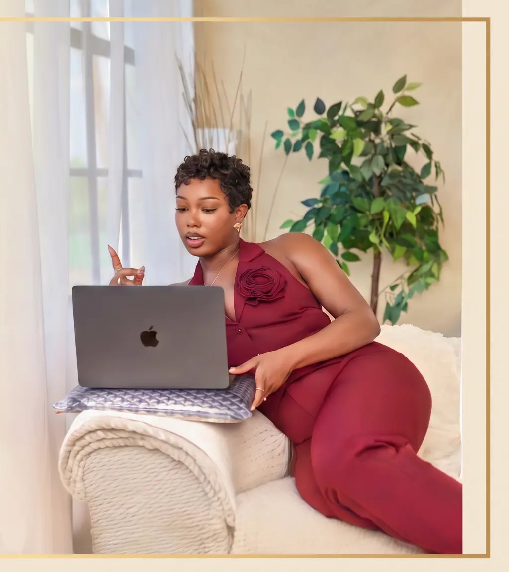Diamond Grant working at a laptop, founder of DimeDocs Consulting Agency