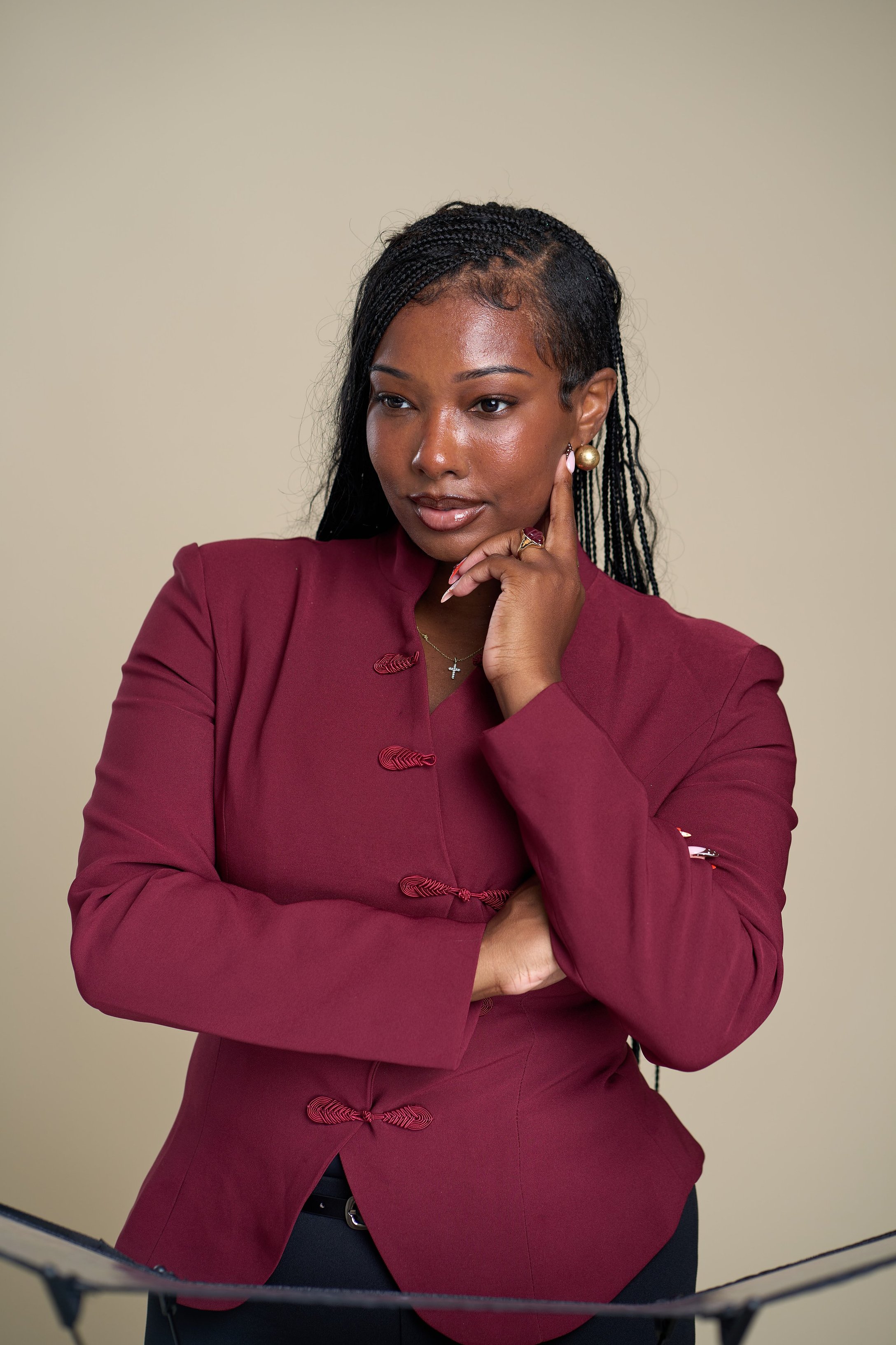 Diamond Grant in a burgundy jacket, founder of DimeDocs Consulting Agency