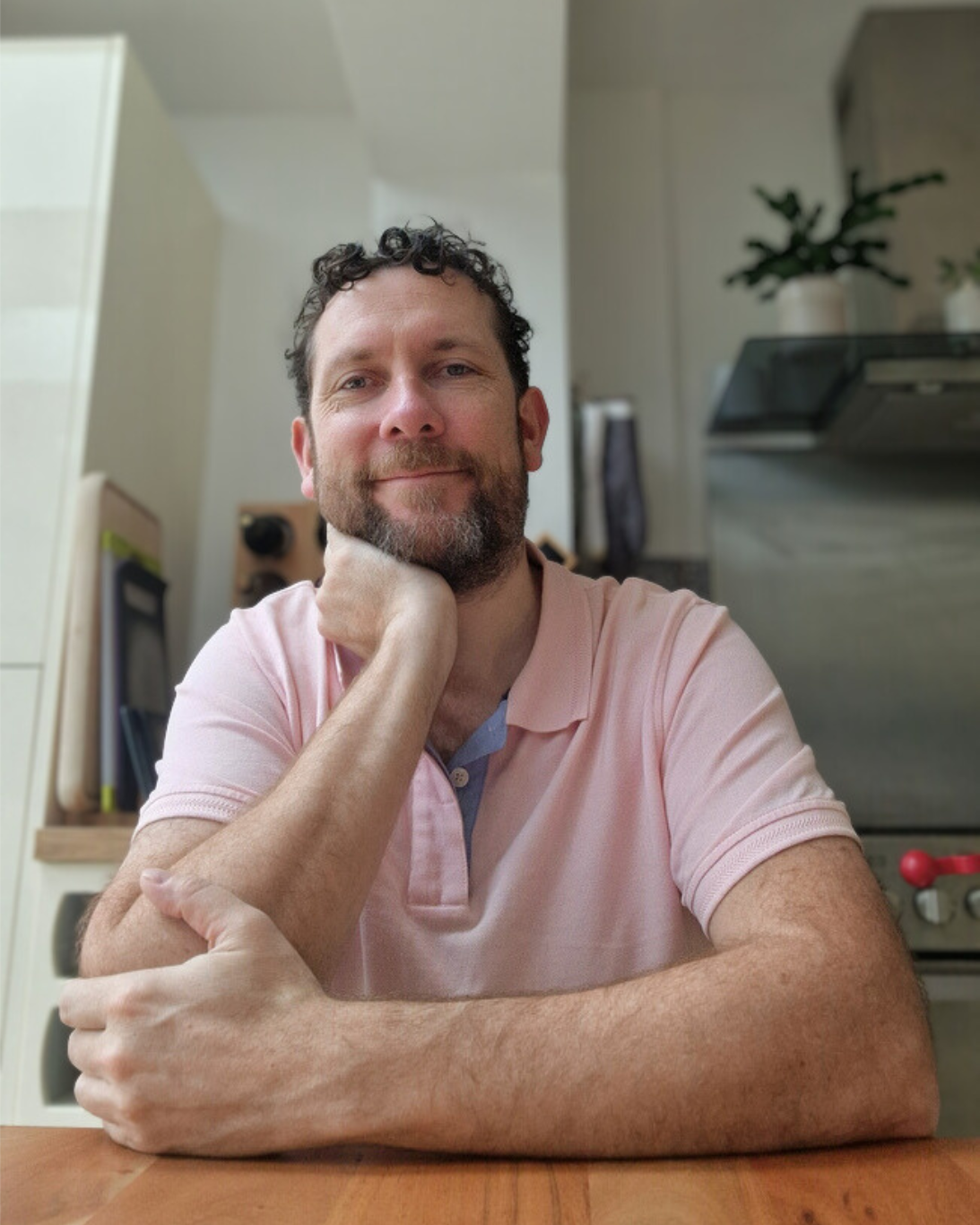 Paul Dykes, Self Leadership coach, sitting at his kitchen table