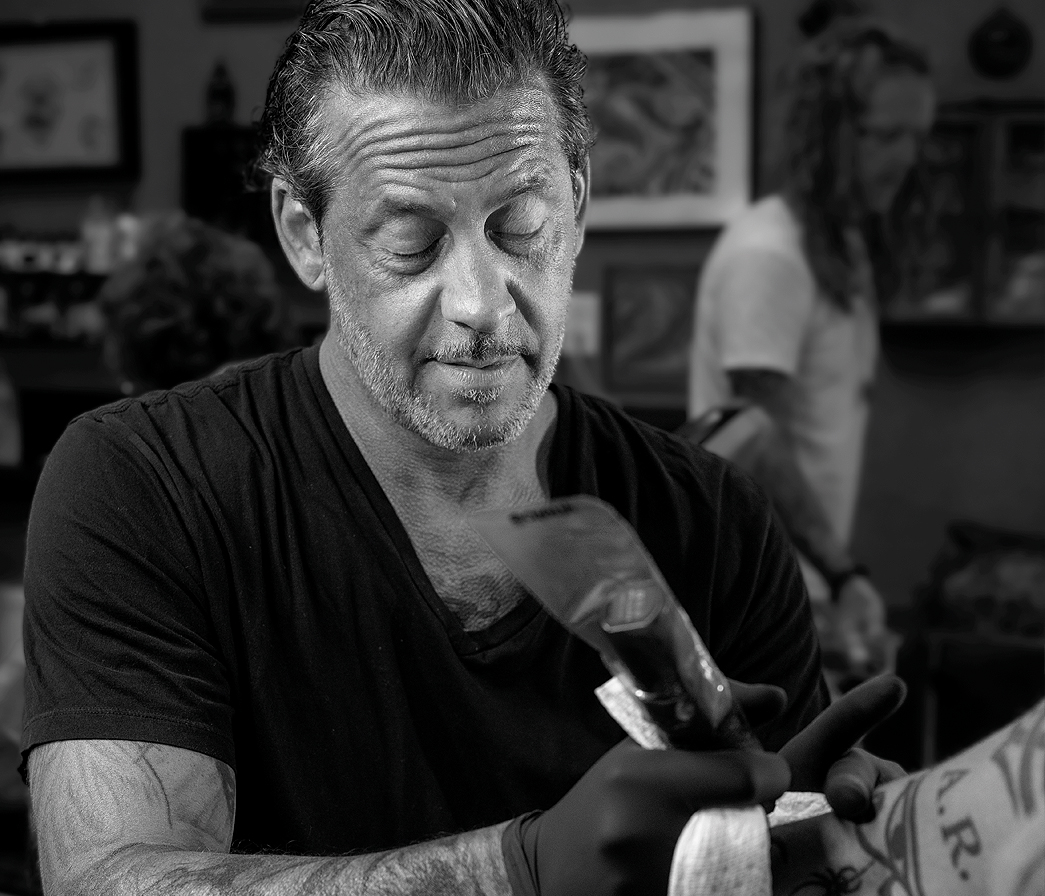 Tattoo artist at Darkside Tattoo and Body Piercing.