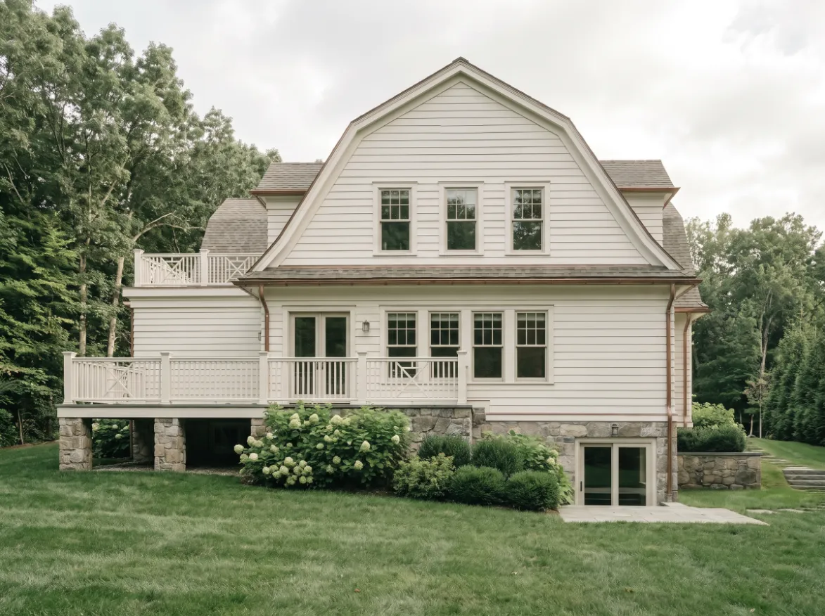 Transitional colonial gambrel in Wellesley, Massachusetts, rear elevation